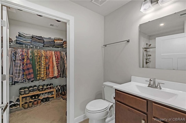 202 Arbordale Loop, Williamsburg, VA 23188 - bathroom with vanity, a spacious closet, toilet, and a shower