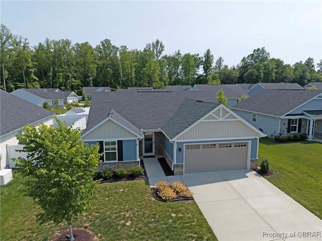 202 Arbordale Loop, Williamsburg, VA 23188 - craftsman-style house with stone siding, a garage, board and batten siding, driveway, and a front yard