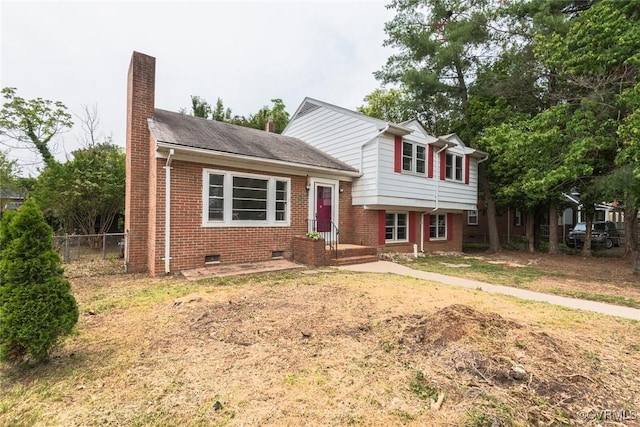 8005 Three Chopt Rd, Henrico, VA 23229 - split level home featuring brick siding, a chimney, and crawl space