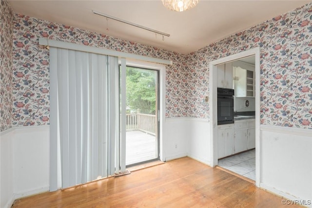 8005 Three Chopt Rd, Henrico, VA 23229 - unfurnished room with wallpapered walls, wainscoting, and light wood finished floors