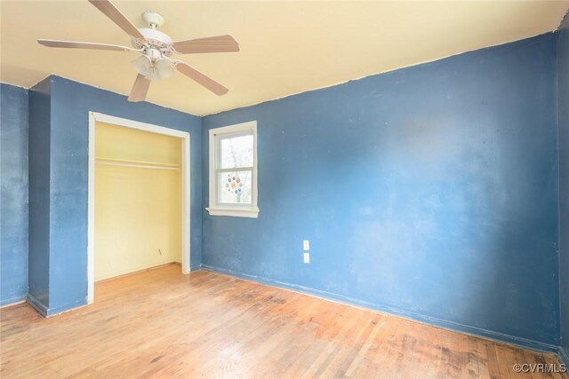 8005 Three Chopt Rd, Henrico, VA 23229 - unfurnished bedroom with wood finished floors, a closet, ceiling fan, and baseboards
