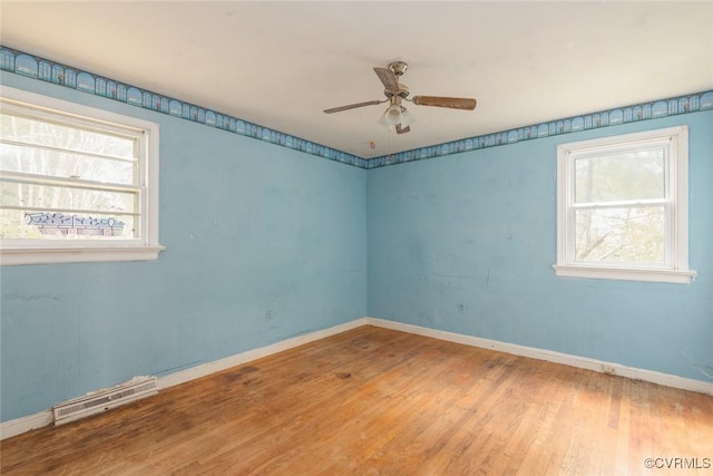 8005 Three Chopt Rd, Henrico, VA 23229 - spare room featuring plenty of natural light, a ceiling fan, wood finished floors, and baseboards