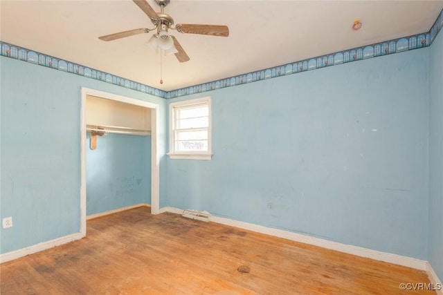 8005 Three Chopt Rd, Henrico, VA 23229 - unfurnished bedroom with wood finished floors, baseboards, a closet, and ceiling fan