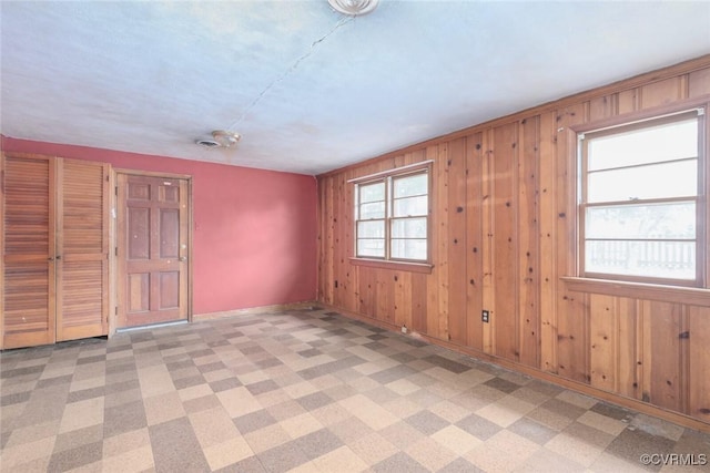 8005 Three Chopt Rd, Henrico, VA 23229 - spare room featuring baseboards and wooden walls