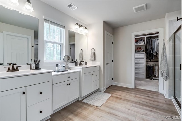 18342 Magnolia Run Ln, Moseley, VA 23120 - full bath featuring a shower stall, double vanity, wood finished floors, and a spacious closet