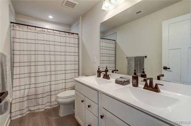 18342 Magnolia Run Ln, Moseley, VA 23120 - full bathroom featuring wood finished floors, double vanity, and curtained shower