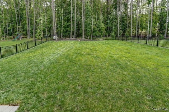 18342 Magnolia Run Ln, Moseley, VA 23120 - fenced backyard featuring a playground