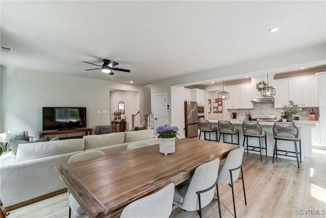 18342 Magnolia Run Ln, Moseley, VA 23120 - dining room featuring stairs, light wood-style flooring, recessed lighting, and a ceiling fan