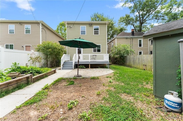 3104 1st Ave, Richmond, VA 23222 - rear view of property with a deck and a vegetable garden