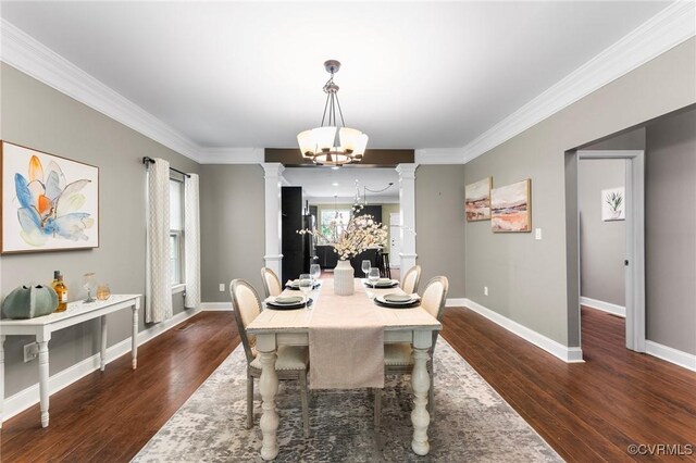 3104 1st Ave, Richmond, VA 23222 - dining area featuring a chandelier, decorative columns, dark wood-style flooring, baseboards, and crown molding