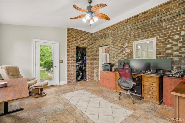 504 Springbranch Rd, Lexington, VA 24450 - office with stone tile floors, ceiling fan, brick wall, and baseboards