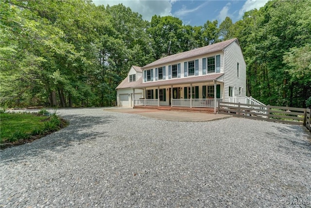 15368 W Fork Dr, Glen Allen, VA 23059 - view of front of property with covered porch, gravel driveway, and an attached garage