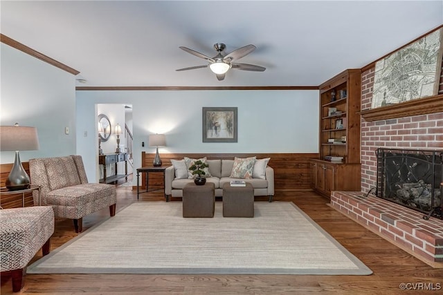 15368 W Fork Dr, Glen Allen, VA 23059 - living room featuring ornamental molding, ceiling fan, a fireplace, built in features, and wood finished floors