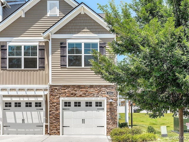 3216 Gannet Ln, Midlothian, VA 23112 - view of front of house with stone siding, concrete driveway, and an attached garage
