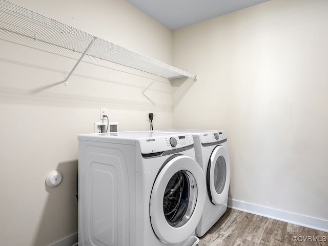 3216 Gannet Ln, Midlothian, VA 23112 - laundry room with washing machine and clothes dryer and light wood-style floors