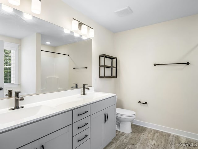 3216 Gannet Ln, Midlothian, VA 23112 - full bath with wood finished floors, double vanity, and a shower