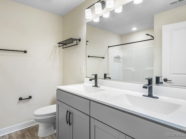 3216 Gannet Ln, Midlothian, VA 23112 - full bath with wood finished floors, double vanity, and a shower