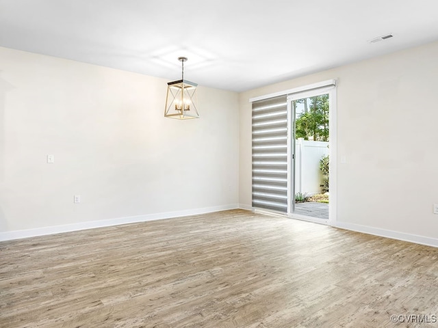 3216 Gannet Ln, Midlothian, VA 23112 - spare room featuring wood finished floors and a chandelier