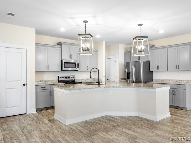 3216 Gannet Ln, Midlothian, VA 23112 - kitchen with stainless steel appliances, gray cabinets, a chandelier, light wood-style floors, and recessed lighting