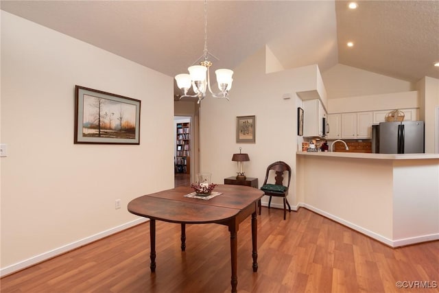 7314 Norwood Pond Pl, Chesterfield, VA 23112 - dining area with a chandelier, light wood finished floors, recessed lighting, and vaulted ceiling