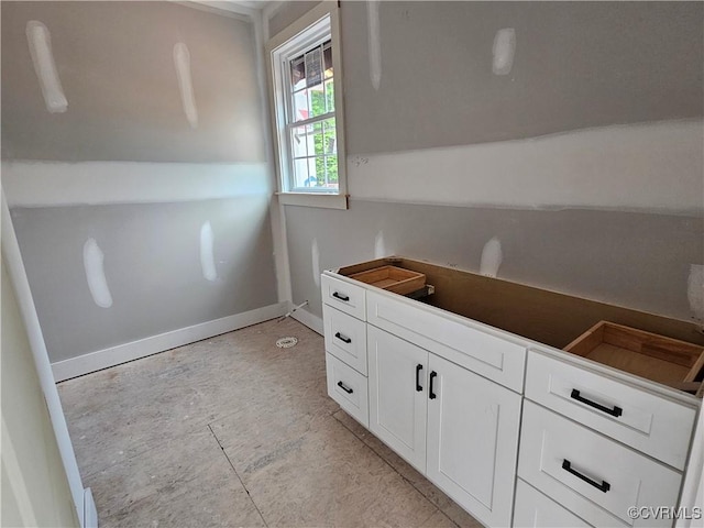 10251 Epps Ln, Amelia Courthouse, VA 23002 - kitchen featuring white cabinets, baseboards, and dark countertops
