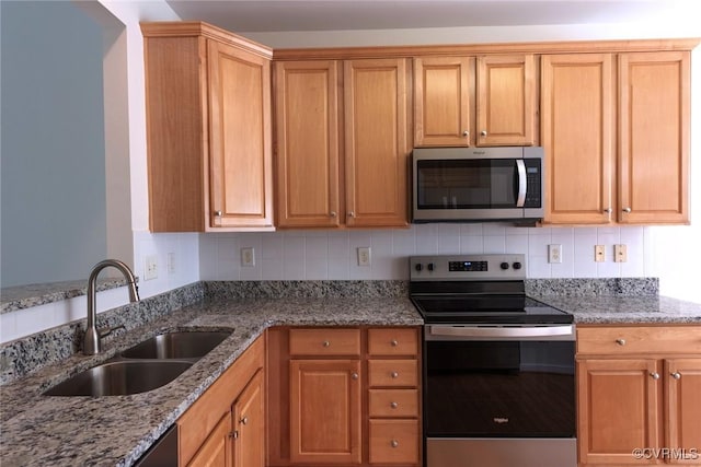 10504 Bishops Gate Dr, Glen Allen, VA 23059 - kitchen featuring appliances with stainless steel finishes, a sink, light stone countertops, and tasteful backsplash