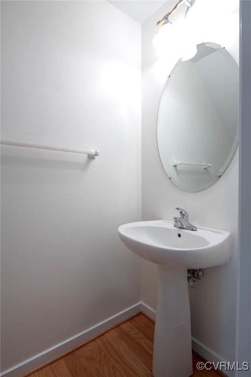 10504 Bishops Gate Dr, Glen Allen, VA 23059 - bathroom featuring baseboards, wood finished floors, and a sink