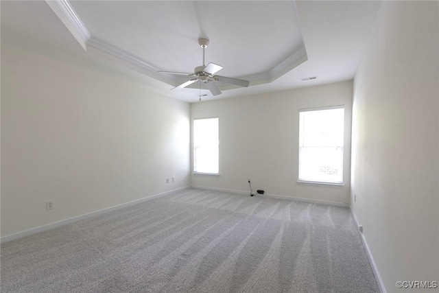 10504 Bishops Gate Dr, Glen Allen, VA 23059 - spare room with a tray ceiling, crown molding, light colored carpet, baseboards, and ceiling fan