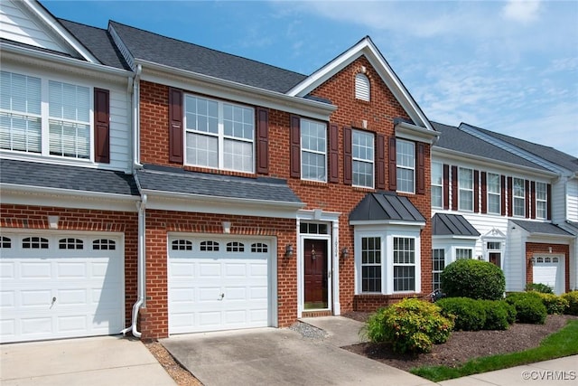 10504 Bishops Gate Dr, Glen Allen, VA 23059 - view of property featuring driveway, brick siding, and an attached garage