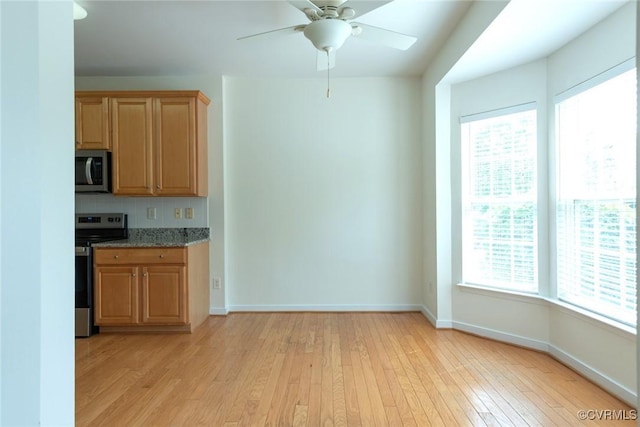 10504 Bishops Gate Dr, Glen Allen, VA 23059 - kitchen with appliances with stainless steel finishes, plenty of natural light, light wood-style flooring, and baseboards