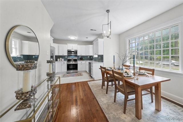 1004 W 45th St, Richmond, VA 23225 - dining room featuring light wood-style flooring and baseboards