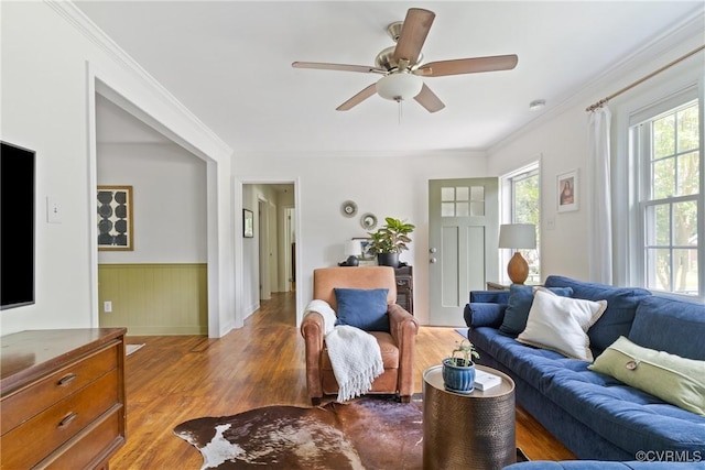 6405 Hagueman Dr, Richmond, VA 23225 - living area featuring wood finished floors, a ceiling fan, a wainscoted wall, and crown molding
