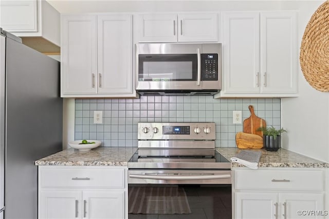 6405 Hagueman Dr, Richmond, VA 23225 - kitchen featuring appliances with stainless steel finishes, white cabinetry, decorative backsplash, and light stone countertops