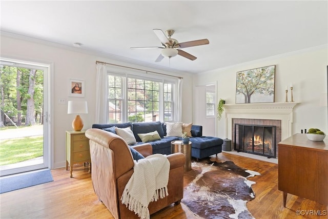 6405 Hagueman Dr, Richmond, VA 23225 - living room featuring ceiling fan, crown molding, a brick fireplace, and light wood finished floors