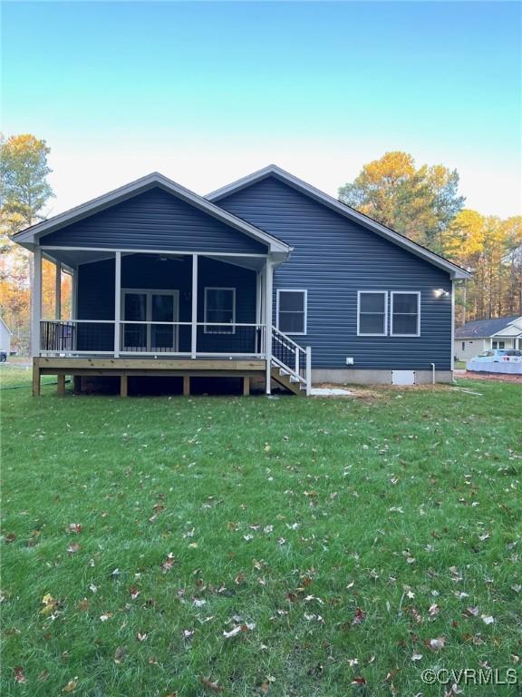 94 Dingley Rd, Montross, VA 22520 - rear view of property featuring a lawn and a sunroom