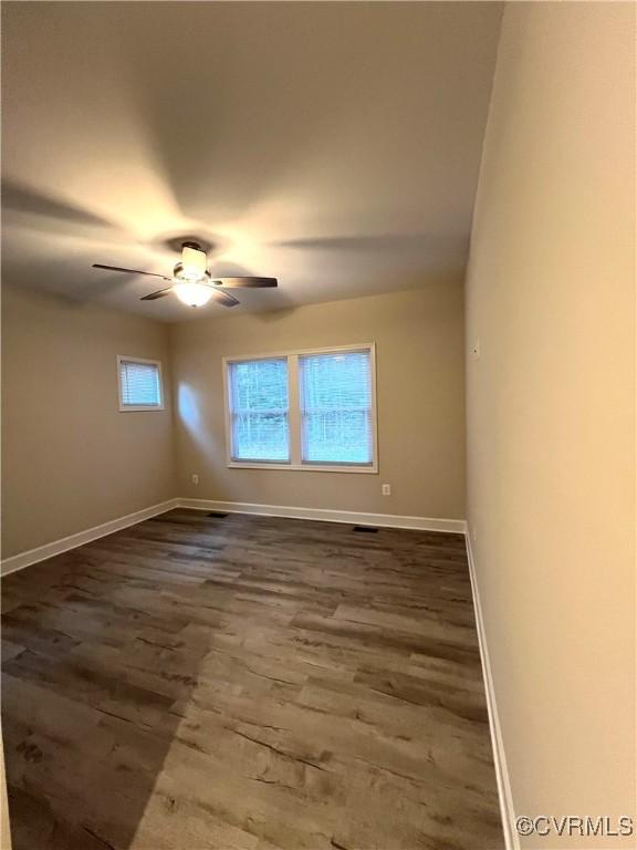 94 Dingley Rd, Montross, VA 22520 - empty room featuring dark wood finished floors, baseboards, and ceiling fan