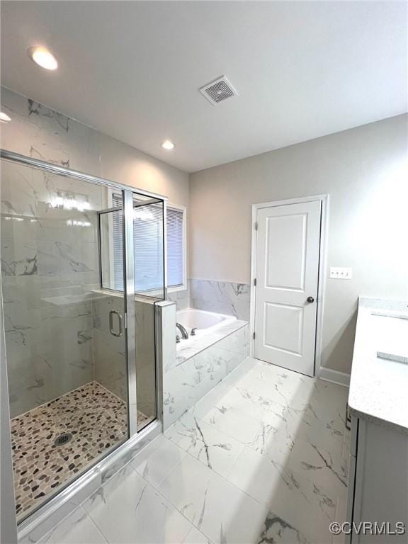 94 Dingley Rd, Montross, VA 22520 - bathroom with vanity, a garden tub, recessed lighting, a marble finish shower, and marble look tiles