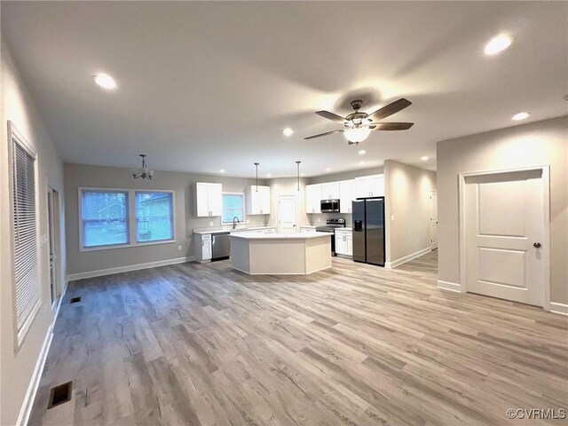 94 Dingley Rd, Montross, VA 22520 - kitchen featuring stainless steel appliances, open floor plan, baseboards, recessed lighting, and a kitchen island