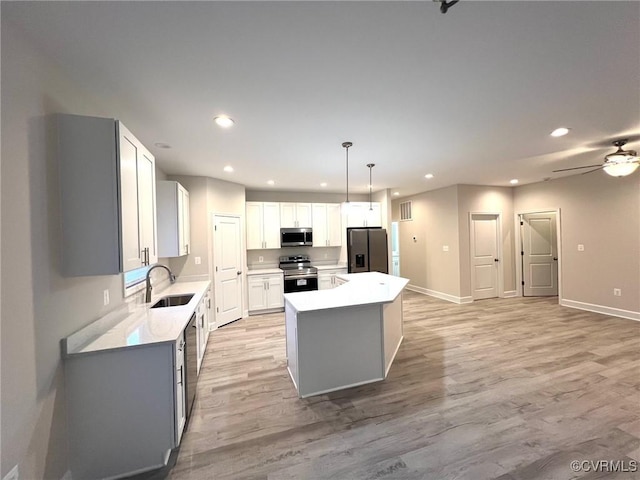 94 Dingley Rd, Montross, VA 22520 - kitchen with appliances with stainless steel finishes, recessed lighting, a sink, a center island, and light wood-type flooring