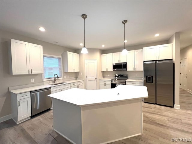 94 Dingley Rd, Montross, VA 22520 - kitchen featuring appliances with stainless steel finishes, a sink, light wood-style flooring, white cabinetry, and recessed lighting