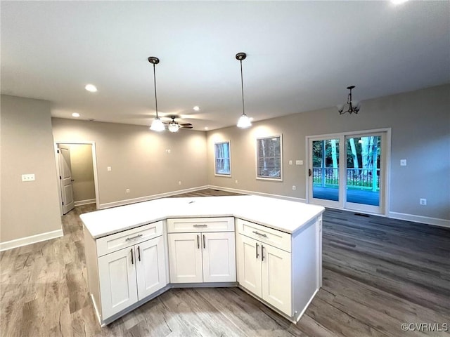 94 Dingley Rd, Montross, VA 22520 - kitchen featuring open floor plan, light wood finished floors, a ceiling fan, white cabinets, and recessed lighting