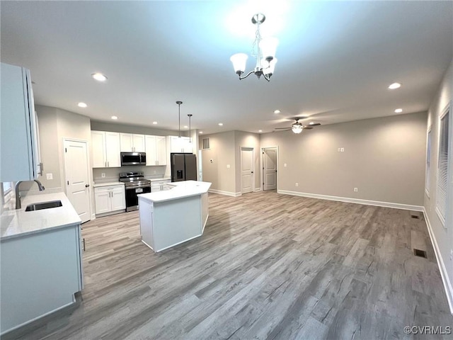94 Dingley Rd, Montross, VA 22520 - kitchen featuring appliances with stainless steel finishes, a sink, recessed lighting, a chandelier, and a ceiling fan