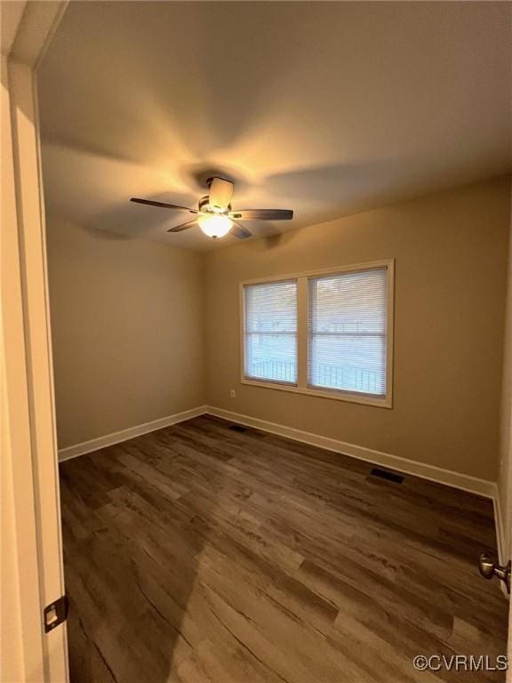 94 Dingley Rd, Montross, VA 22520 - unfurnished room featuring dark wood finished floors, baseboards, and ceiling fan