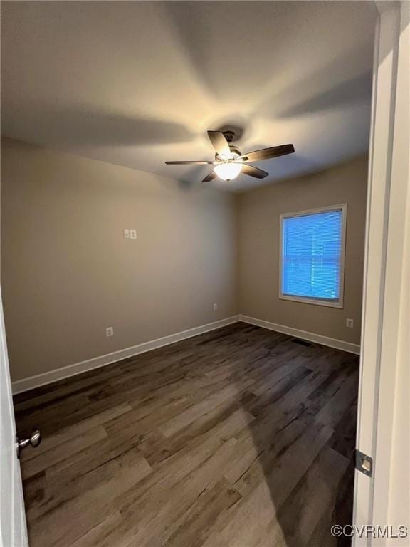 94 Dingley Rd, Montross, VA 22520 - spare room featuring baseboards, dark wood-style floors, and a ceiling fan