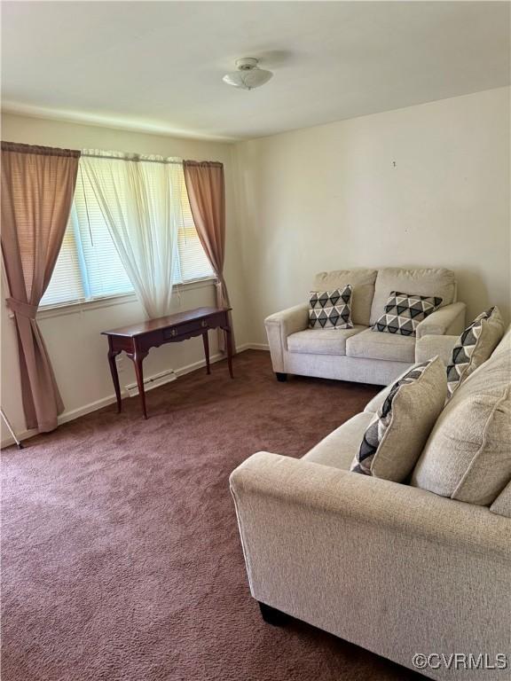 1501 Campbell Dr, Petersburg, VA 23803 - living area featuring dark carpet and baseboard heating
