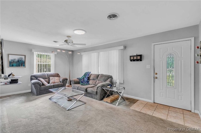 7486 Roaring Springs Rd, Gloucester, VA 23062 - carpeted living room featuring ceiling fan, baseboards, and tile patterned flooring