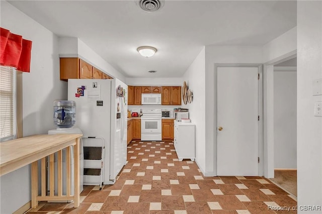 7486 Roaring Springs Rd, Gloucester, VA 23062 - kitchen featuring white appliances, light countertops, and brown cabinets