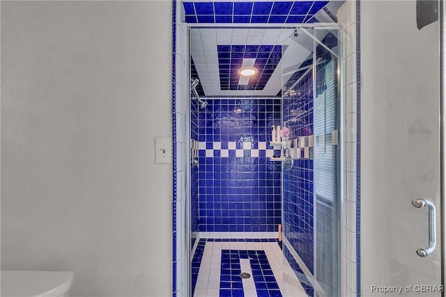 7486 Roaring Springs Rd, Gloucester, VA 23062 - full bath with a stall shower, toilet, and tile patterned floors