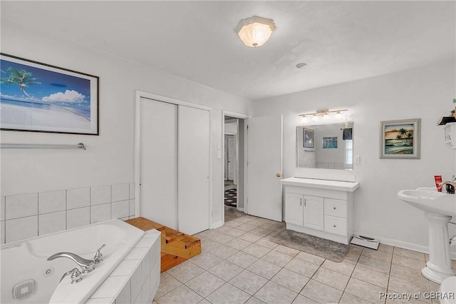 7486 Roaring Springs Rd, Gloucester, VA 23062 - bathroom with a garden tub, tile patterned floors, and baseboards