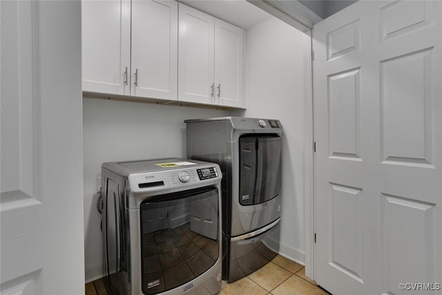 6216 Pine Slash Rd, Mechanicsville, VA 23116 - laundry area featuring washing machine and dryer, cabinet space, and light tile patterned floors